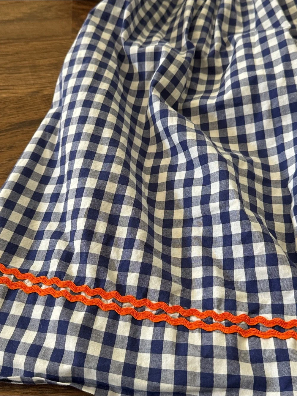 Cecil And Lou Navy Gingham Smocked Dress with Smocked Orange Pumpkin Embroidery
